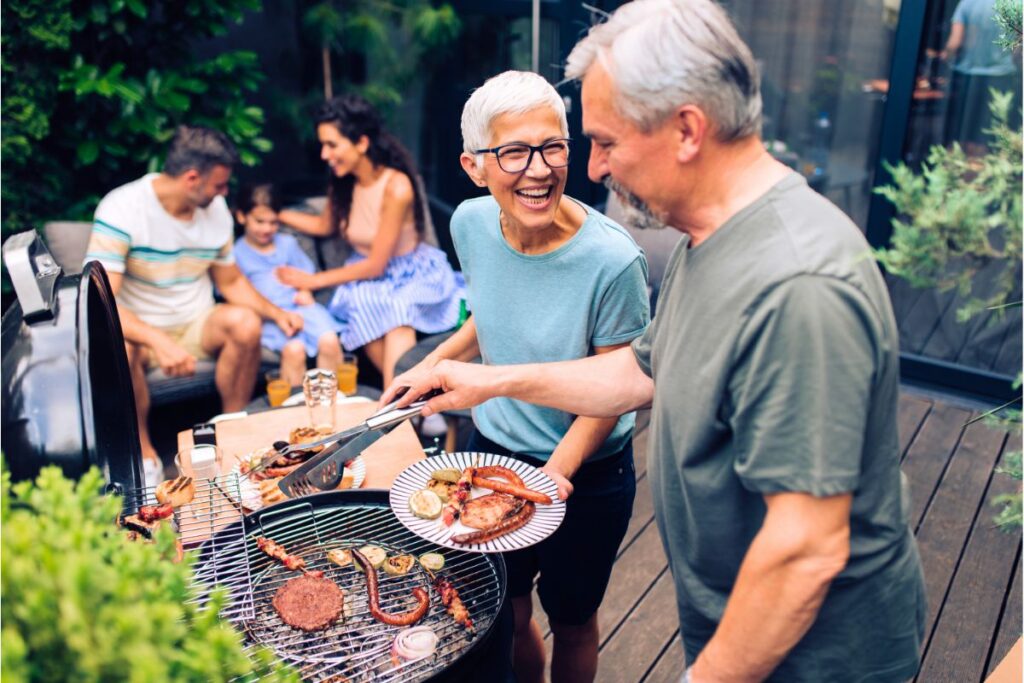 seniors having fun on the family bbq party at the deck patio