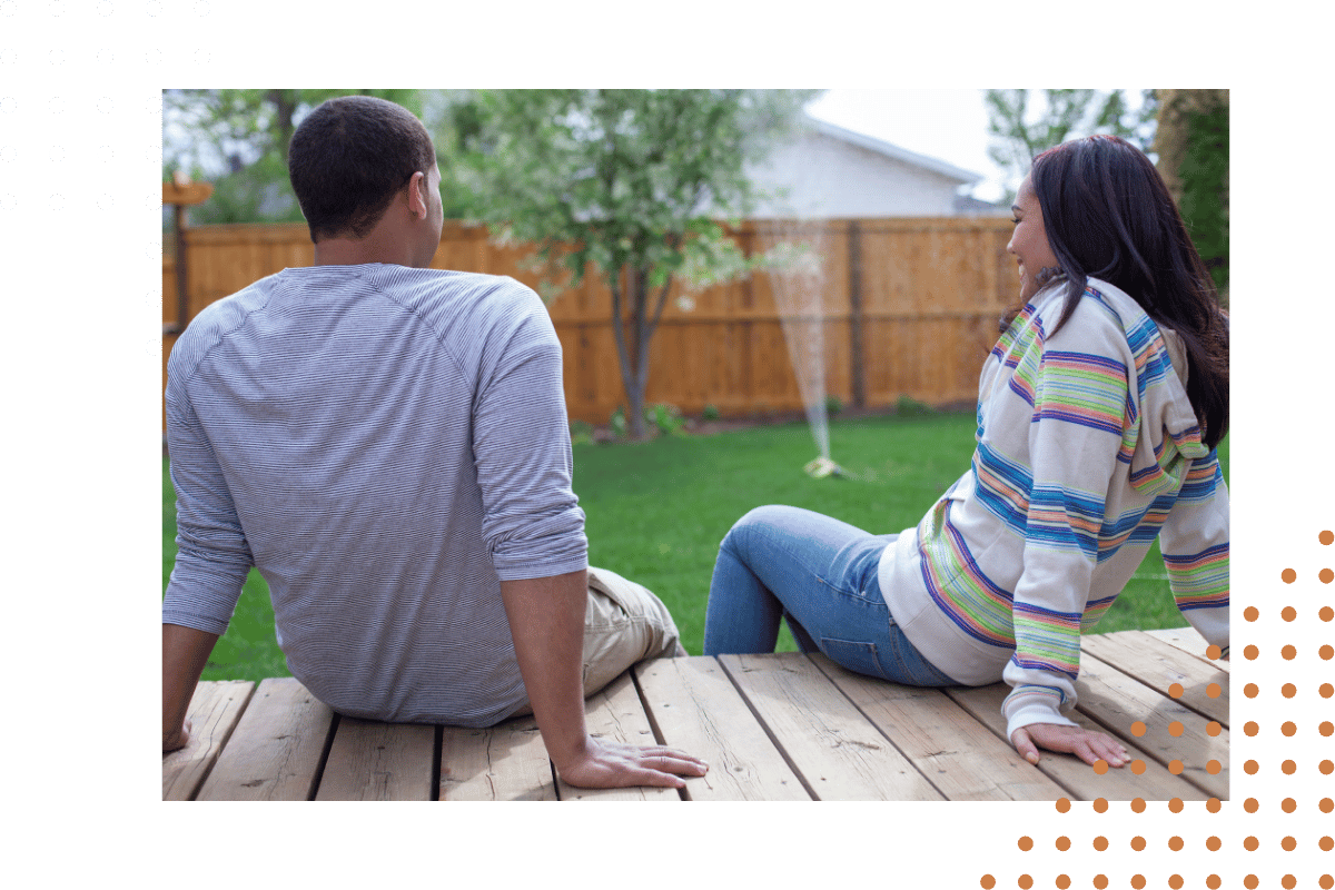 couple sitiing on the backyard porch