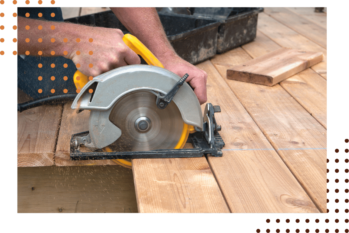 deck builder cutting wood deck