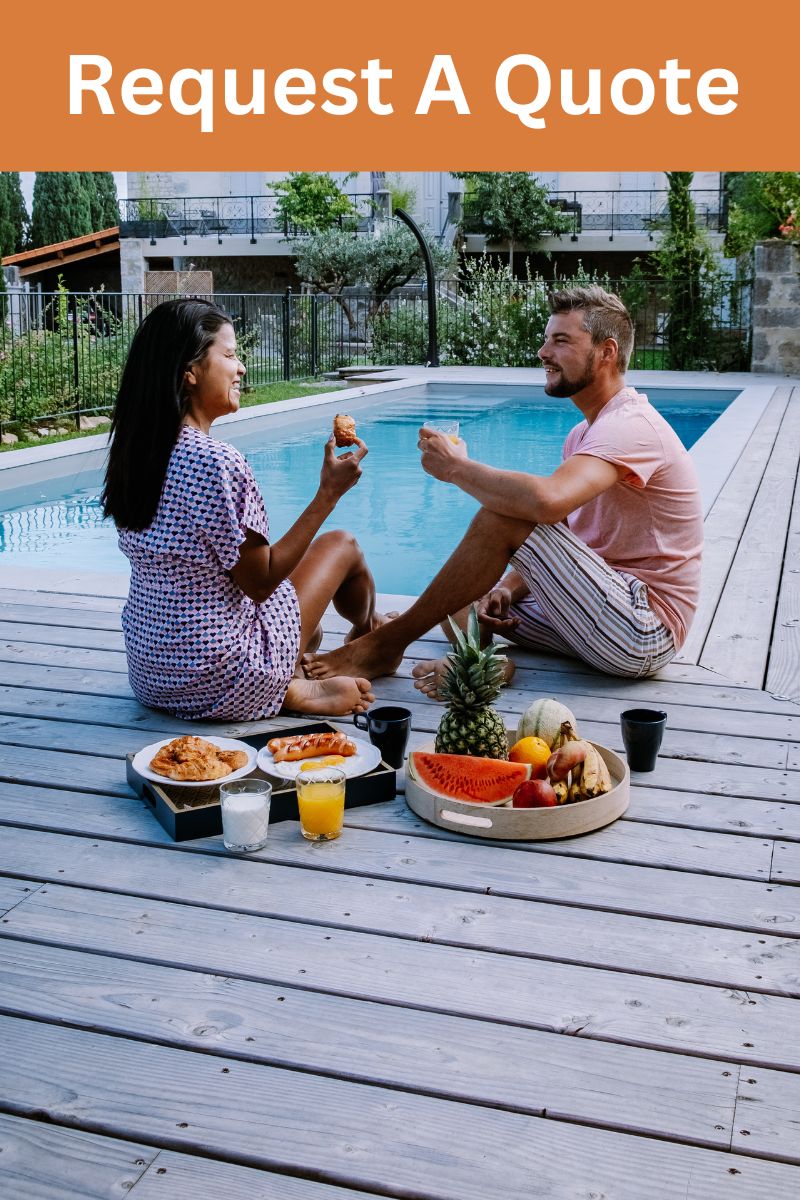 couple sitting and eating fruits in pool decks