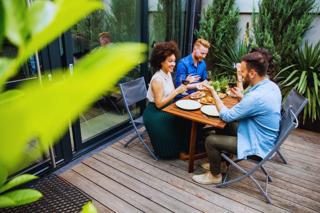 friends eating outdoor patio