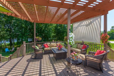 spacious backyard patio deck with pergola