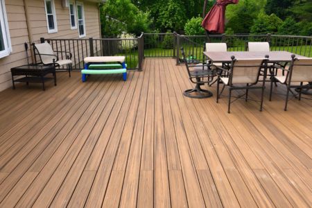 composite outdoor deck with tables and chairs